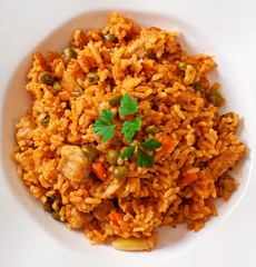 Pilaf with chicken, carrot and green peas