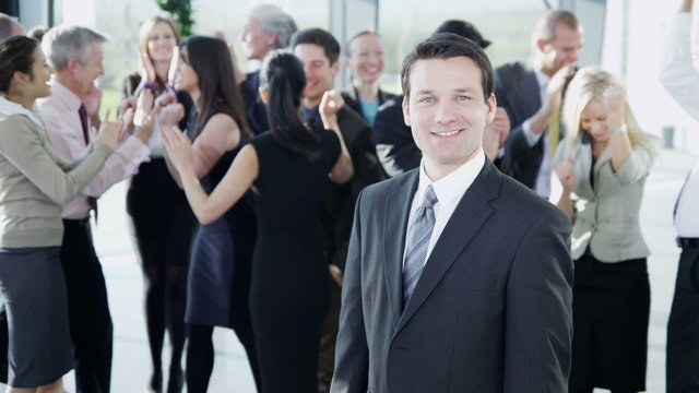 Attractive diverse business team in a light modern office building