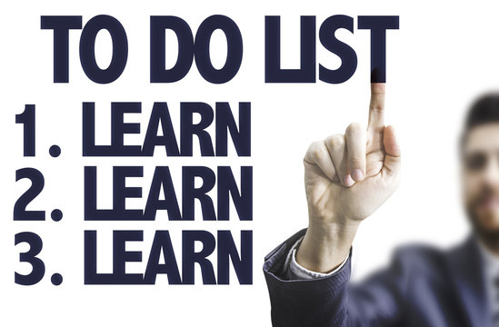 Business man pointing the text: To Do List - Learn