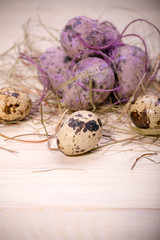 Obraz premium Easter eggs in a nest from a dry grass