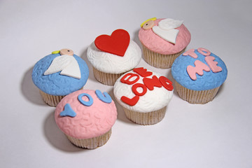 six sweet mastic cupcake on white