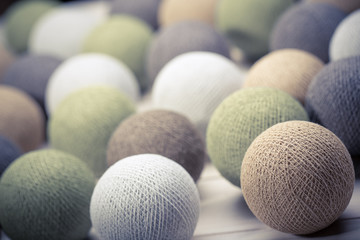 collection of colourful wool balls on white background
