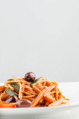 Italian spaghetti pasta with tomato based sauce