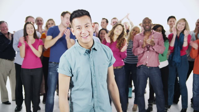 Happy, diverse group in casual clothing, isolated on white in a studio shot