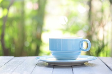 coffee in blue cup on wooden table