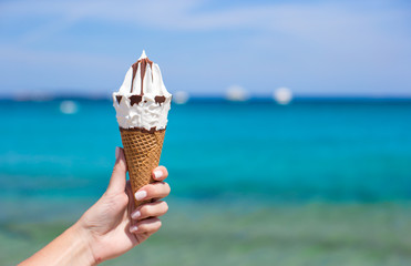 Tasty ice cream in waffle background the turquoise sea