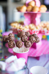 Chocolate cakepops on holiday dessert table at kid birthday