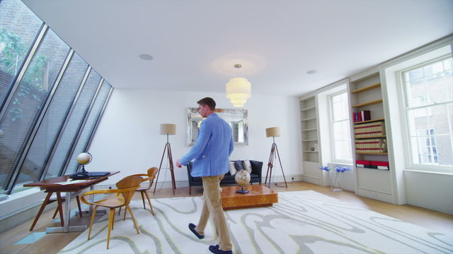 Businessman or entrepreneur working at his desk in stylish home office