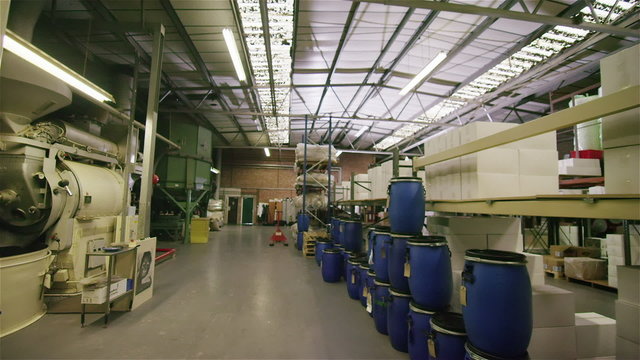 Interior view of an empty coffee distribution and processing plant. No people.