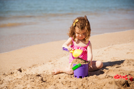 Girl Building A Sand Castle