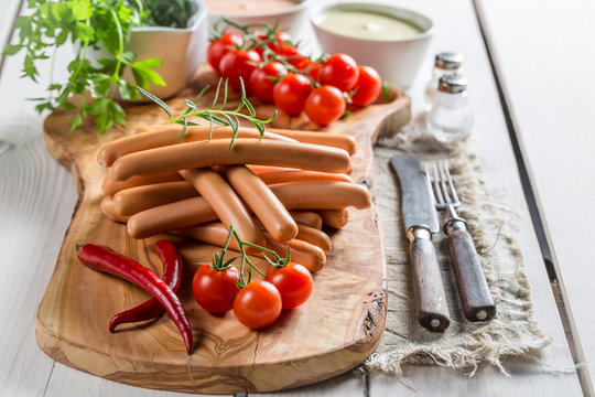 Fresh sausages with vegetables and herbs