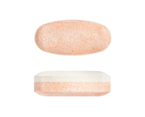 Macro orange medical pill tablet two foreshortenings