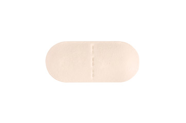 Macro orange medical pill tablet isolated on white