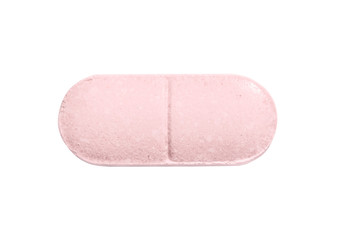 Macro pink medical pill tablet isolated on white
