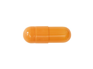 Macro orange medical pill tablet isolated on white
