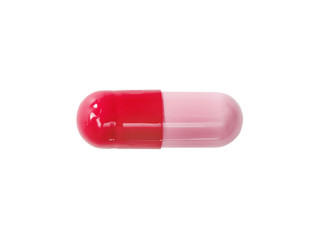 Macro red medical pill tablet isolated on white