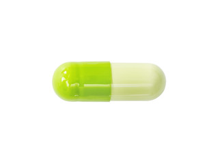 Macro green medical pill tablet isolated on white