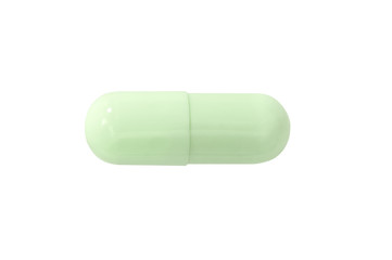 Macro green medical pill tablet isolated on white