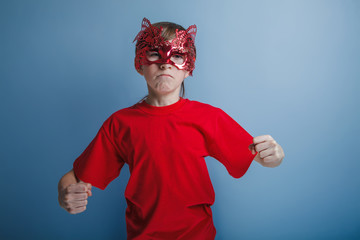boy teenager European appearance in a red shirt brown in a red m