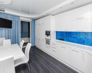 Specious modern white blue interior kitchen-dining room 