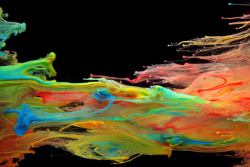 Colorful ink swirling through water