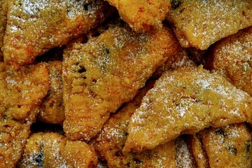 Carrot chou pastry breadroll texture with sugar powder on top