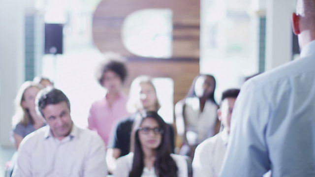 Cheerful diverse business group at business presentation or training seminar