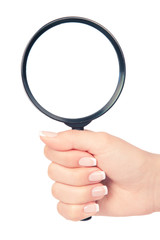 Hand holding magnifying glass on white backckground