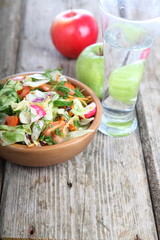 Vegetable salad and ripe fruits