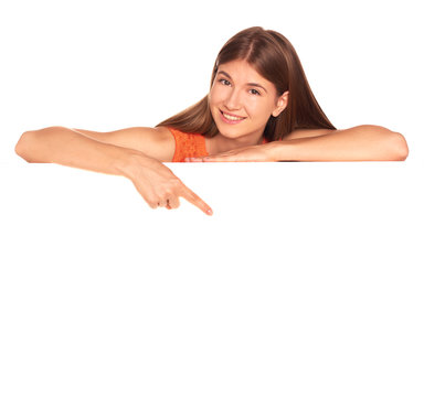 Girl in orange dress behind white board