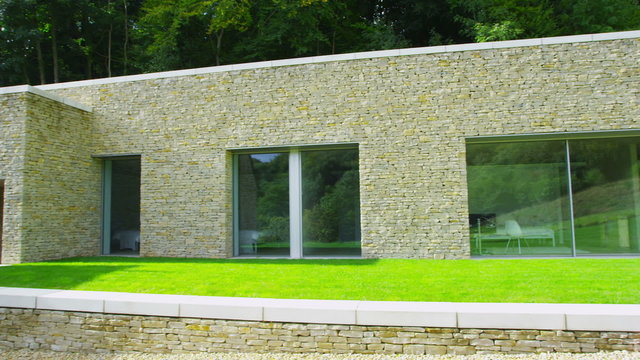 Exterior view of a traditional English cottage with contemporary built extension