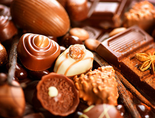 Chocolates background. Praline chocolate sweets
