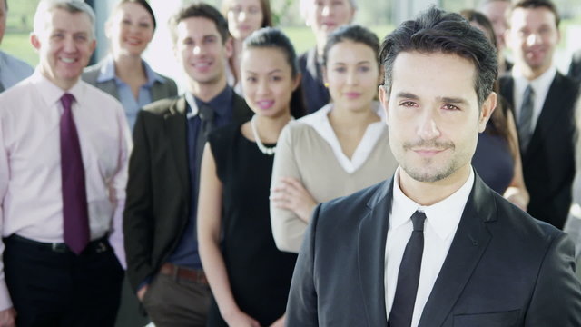 Attractive diverse business team in a light modern office building