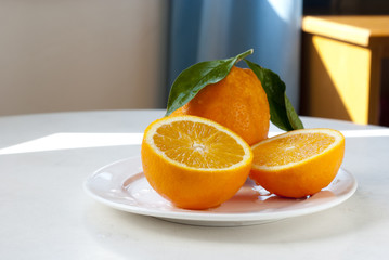 oranges on white plate