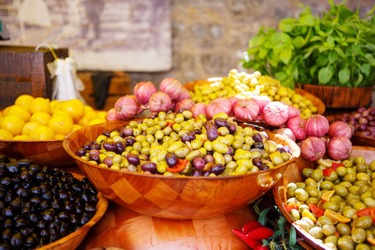 Marinated garlic and olives on provencal street market in Proven