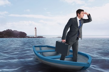 Composite image of businessman in boat