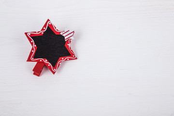 Fototapeta na wymiar star shaped blackboard on wooden surface