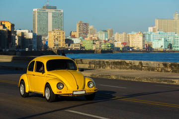 HAVANA - FEBRUARY 26: Classic car and antique buildings on Febru