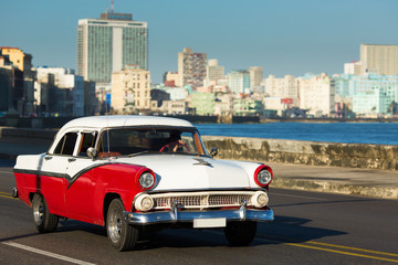 HAVANA - FEBRUARY 26: Classic car and antique buildings on Febru