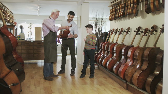 Portrait of shopkeeper in a violin shop