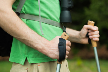 Close-up image of hiker holding hiking poles
