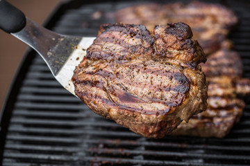 Beef steak on spatula BBQ grilled
