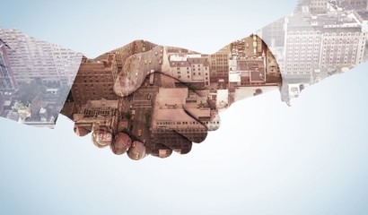 Composite image of close-up shot of a handshake