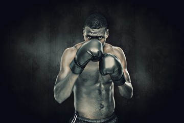 Fototapeta na wymiar Composite image of muscular boxer