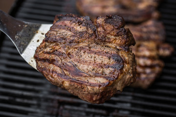 Beef steak on spatula BBQ grilled