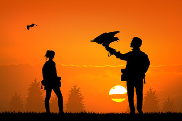 Obraz premium falconry at sunset