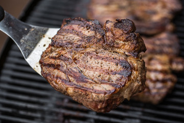 Beef steak on spatula BBQ grilled