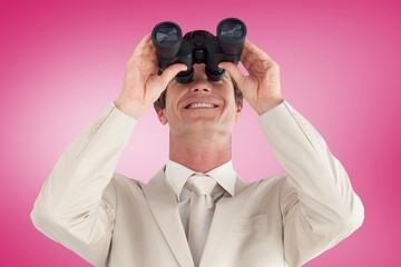 Composite image of confident businessman with binoculars