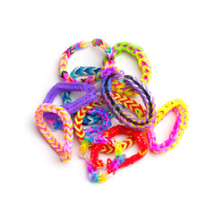 Group of colorful rubber band bracelets isolated on white