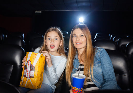 Surprised Mother And Daughter Watching Film